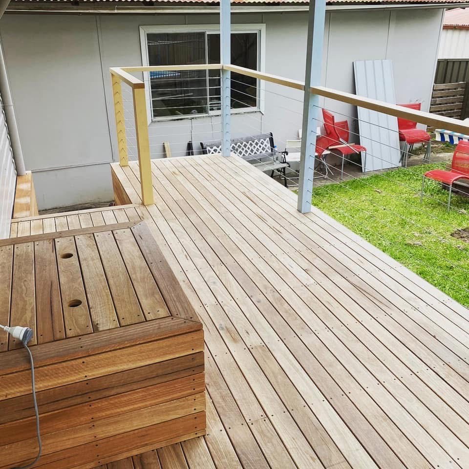 Timber deck with wire balustrade and built-in bench seating in Lambton